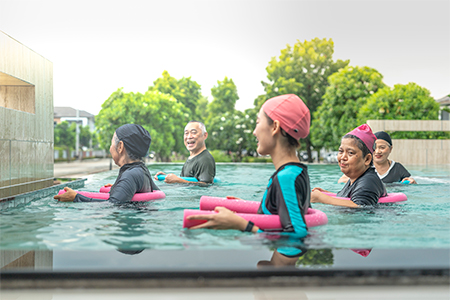 senior aquatic class practicing water relaxation and float