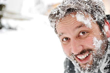 Close up of face covered in snow