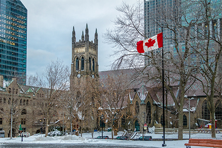 St. George's Anglican Church at Canada Square with flag - Montreal, Quebec