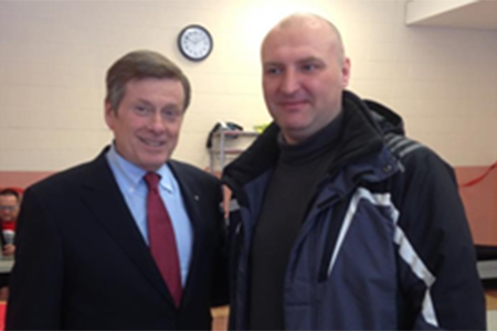 Vitaly standing with Toronto Mayor John Tory