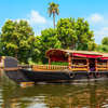 A houseboat sailing in Alappuzha backwaters in Kerala state in India