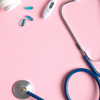 Flat lay composition with stethoscope, pills and thermometer on pink background