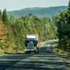 Semi truck on Highway in deep forest in Canada ontario quebec