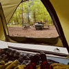 a person lying down in camping tent relaxing