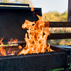 Close-up of brazier with flame of burning coals