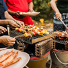 Skewers with colorful vegetables meat grilling, family friends gathering background