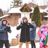 People having fun, dancing and singing in snow weather