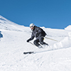 shot from behind - woman on skiis