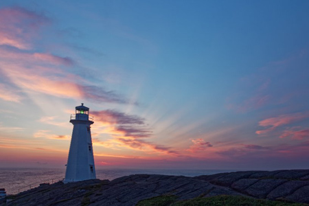 Beautiful historic Cape Spear Lighthouse on the Atlantic Coast at sunrise.