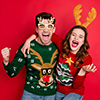 Happy couple wearing holiday sweaters