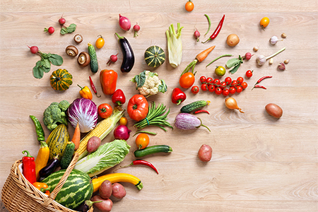 studio photography of different fruits and vegetables on wooden table