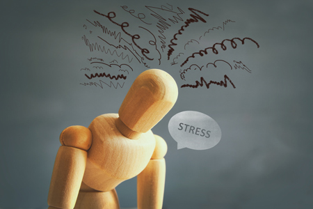 image of wooden dummy with worried stressed thoughts