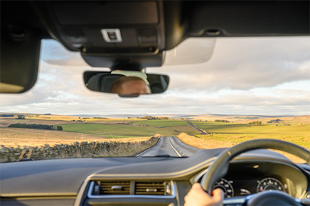 driving in a car through the countryside