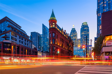 The famous Gooderham building and the skyscrapers in the background