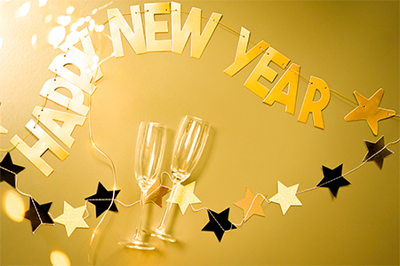 Golden text Happy New Year on the golden background