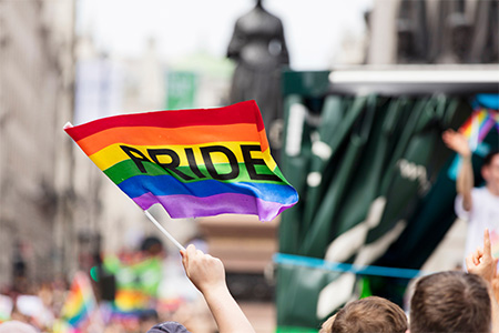 LGBT rainbow flag waved at a pride march