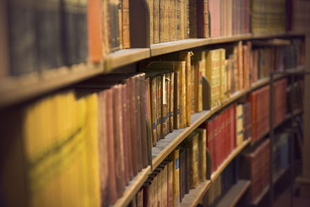 curved library shelf full of books