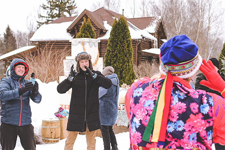 People having fun, dancing and singing in snow weather