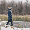 Winter snow happy cold weather girl walking in snowing forest