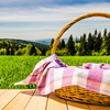 A charm-filled picnic spot, a crafted basket rests on a wooden table