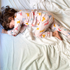 Top view of cute little girl sleeping in bed