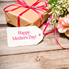 gift box and flowers on wood counter