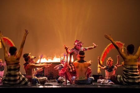 Balinese dancers in traditional costume performing on stage in the dance performance on Devian show.