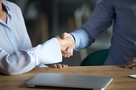 cropped image of handshake - business attire