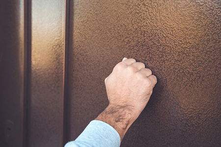 man knocking on door- cropped