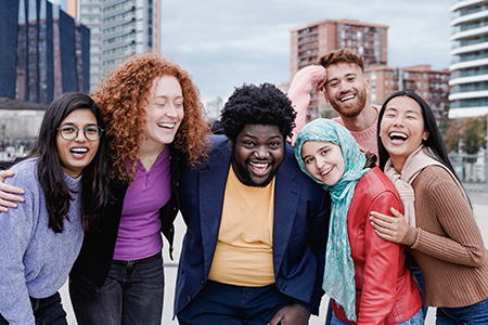 Multiracial happy friends having fun outdoor in city