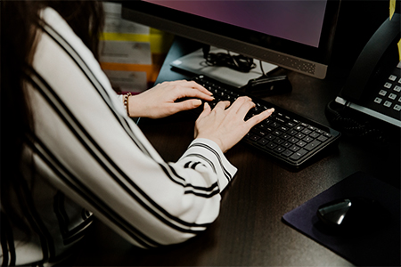 co-op student typing on the keyboard