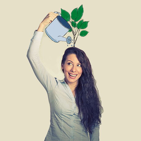 Women watering plant on the head.