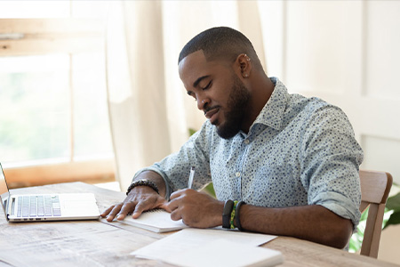 Man studying in front of computer