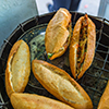 Vietnamese sandwich- Banh Mi on the heating charcoal stove