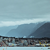 photo of vancouver taken from water - mountains visible in background