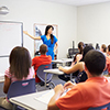 Female High School Teacher Taking Class