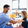 Child with face mask getting vaccinated, coronavirus, covid-19 and vaccination concept.