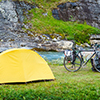 Tents, bikes, next to lake