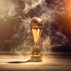 soccer sports trophy cup on wood desk with dramatic strong contrast light