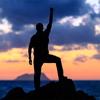 Success achievement and motivation concept with man sunset silhouette