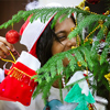 Little girl happy decorating the Christmas tree