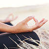 Woman meditating practicing yoga outdoors