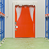 Warehouse freezer door covered in ice and frost