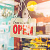 Open sign broad through the glass of door in cafe. Business service and food concept. Vintage tone f