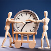 Two wooden figure holding a clock - concept