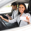 Instructor Man Taking Notes While Happy Driver Pretty Young Woman Showing Her Driving License