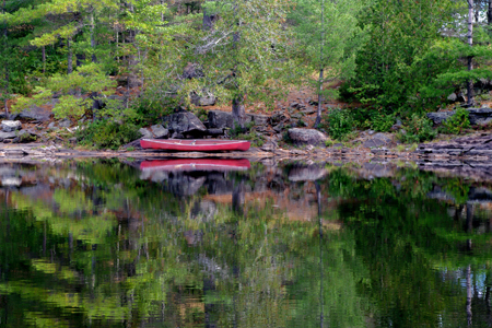 Canoe on the Lake Shore in Algonquin Park at High Falls