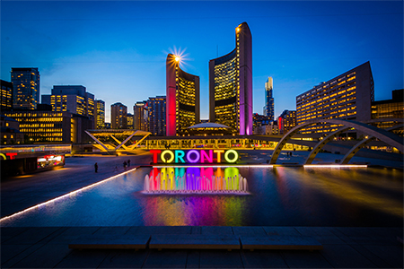 View of Nathan Phillips Square and Toronto Sign in downtown at night, in Toronto, Ontario