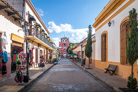 Pedestrian street and Del Carmen Arch Tower (Arco Torre del Carmen) - San Cristobal de las Casas, Ch