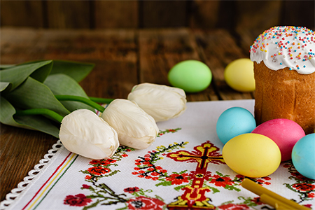 Happy Easter. Congratulatory easter background. Easter eggs and flowers